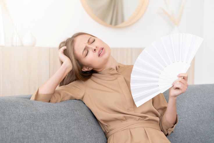 girl on gray couch sitting