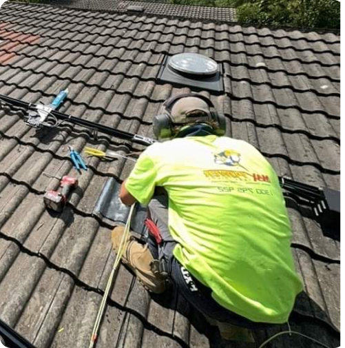 man working on roof